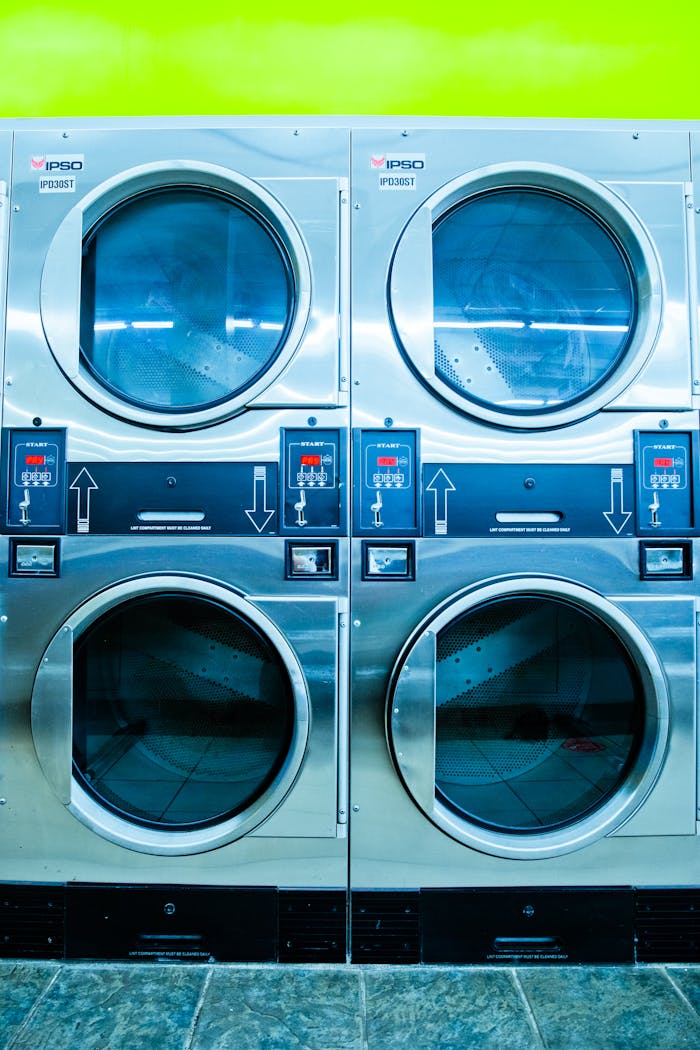 Stylish commercial washing machines in a laundromat setup, perfect for business use.